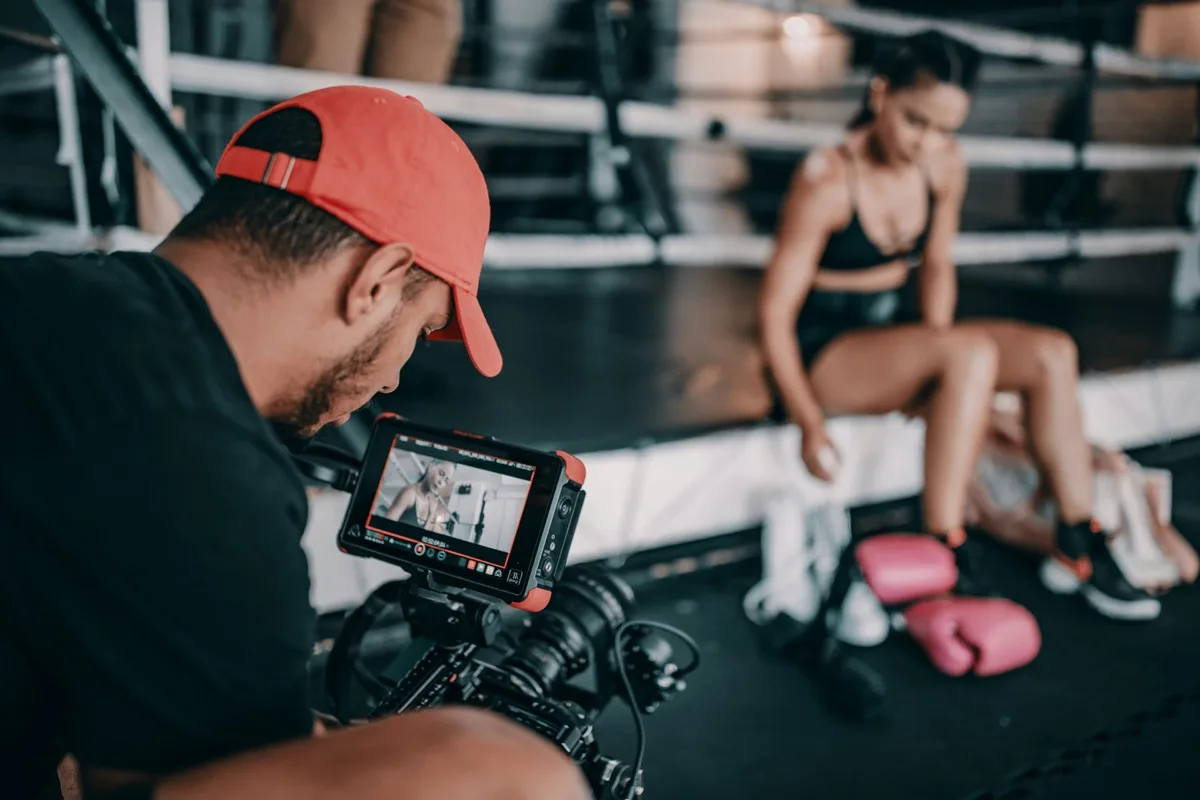 Content creator filming a training session at HQ Athletics